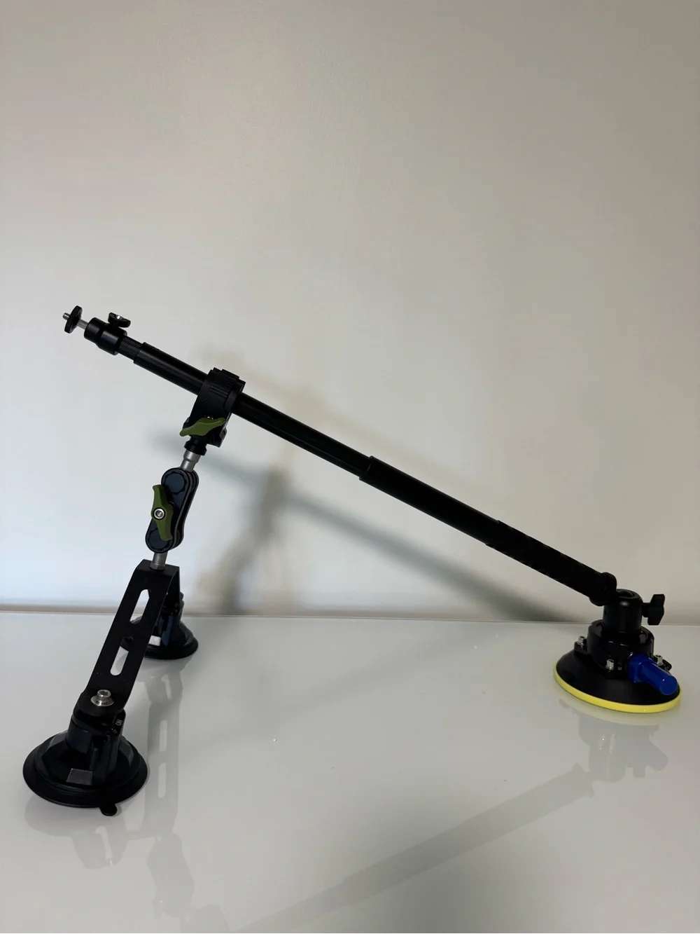Adjustable Black Camera Mounting Arm with Green Accents